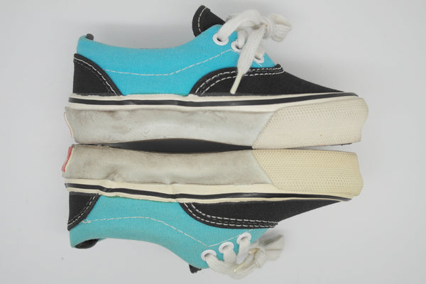 Aqua and black vans shop